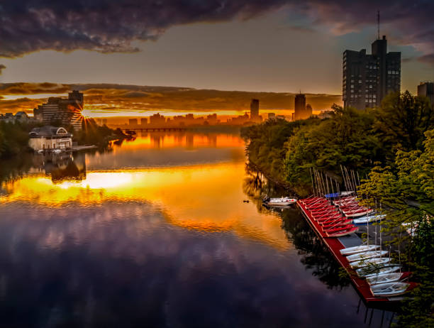 Charles River at Sunrise Charles River at sunrise with clouds & city charles river stock pictures, royalty-free photos & images