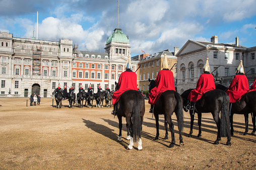 London, United Kingdom - January 18 2018: Members of the Queen's Royal Horse Guards on horses, riding to the changing of the guard ceremony in Horse Guards Parade, London United Kingdom