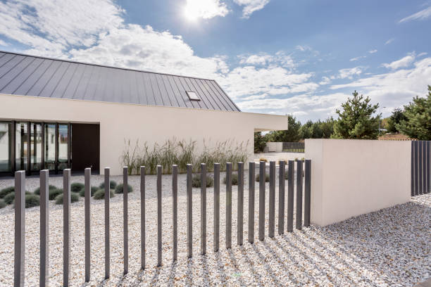 istock Fence of spacious white house 919825154