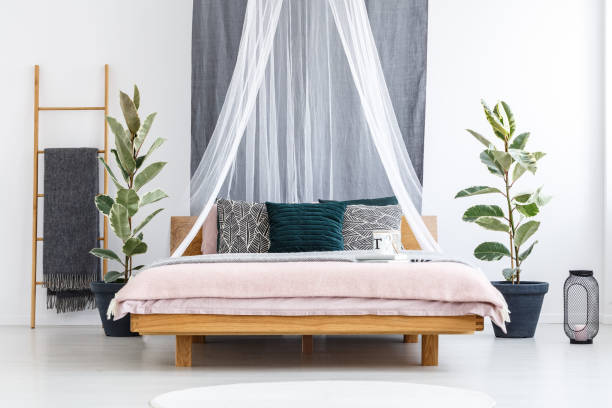 istock White veil over wooden bed 919826170