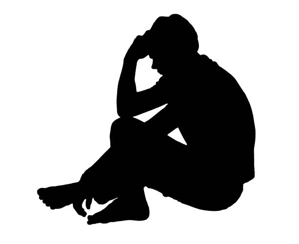 Side profile portrait silhouette of depressed teenage boy sitting on ground thinking Side profile portrait silhouette of a depressed teenage boy sitting on ground thinking silhouette of bad boy stock illustrations