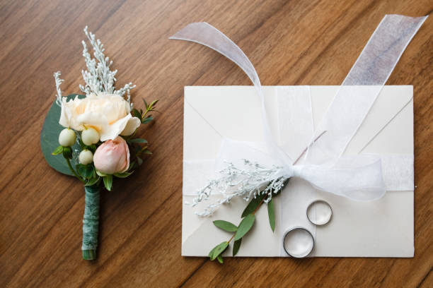 istock Wedding Invitation Cards Papers Laying on Table 919874534