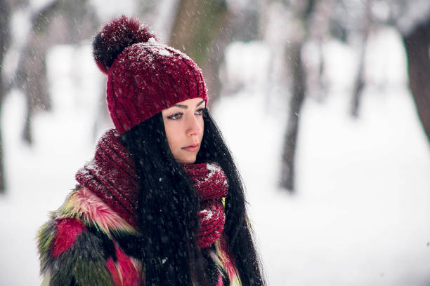 istock The girl is standing under a spruce branch 919884468