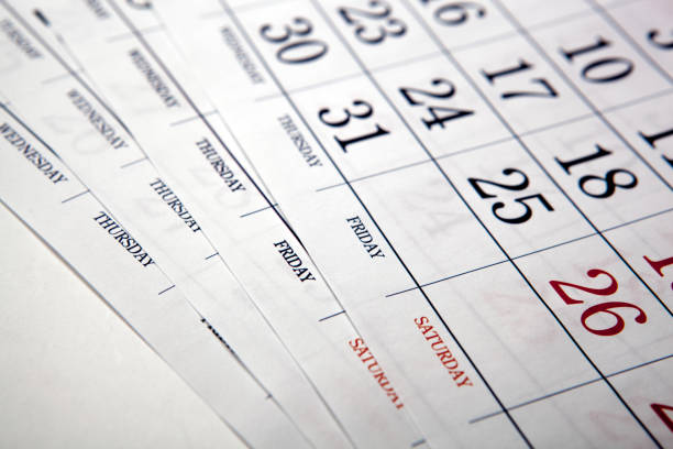 istock big pile of printed wall calendar sheets closeup 919885082