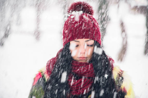 istock Girl in snowflakes close-up 919905250