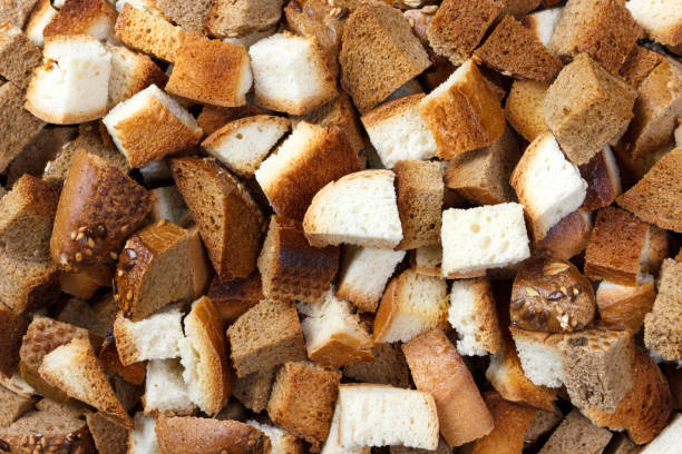 istock Background from many small rusks on wooden table. Top view 919905596