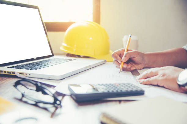 istock Team of engineers working together in a architect office. 919911794