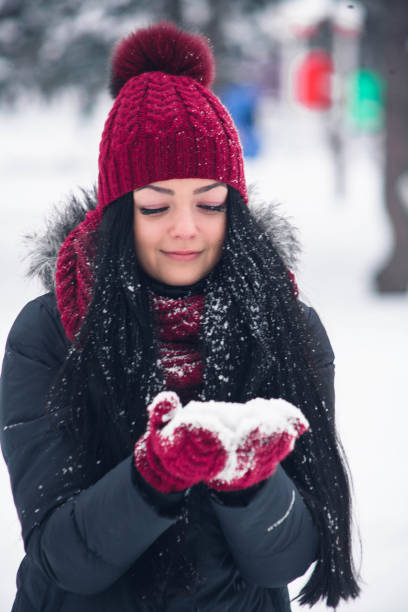 istock Young woman rushes with snow 919918530