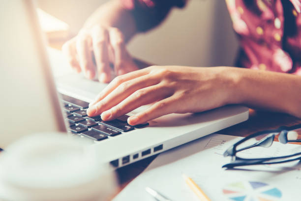 istock Business woman working on laptop computer in office 919919450