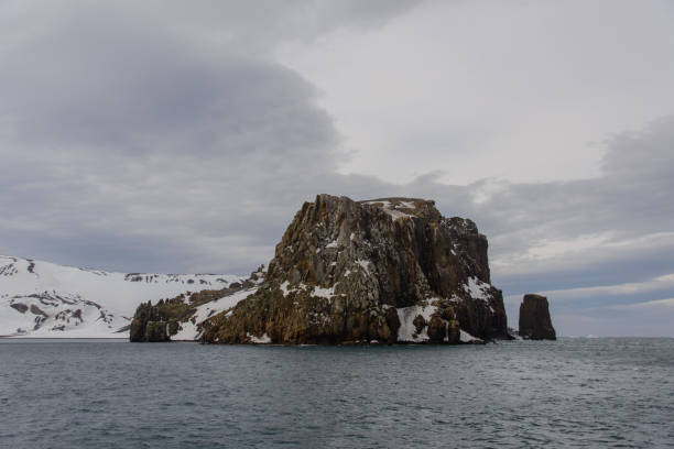 istock Rock in Antarctic sea near Deception island 919942704