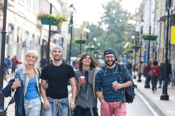 istock Tourists walking on street 919963346