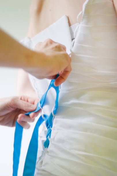 istock Helping putting on a dress in the back 919963654