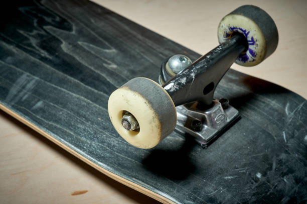 istock used skateboard on a wooden background 919963660