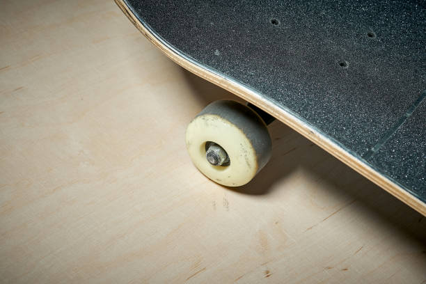 istock used skateboard on a wooden background 919963692