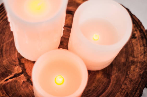 istock Candles on wooden material 919981304