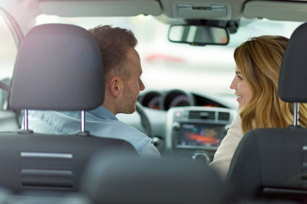 istock Young couple sitting in a car 919992064