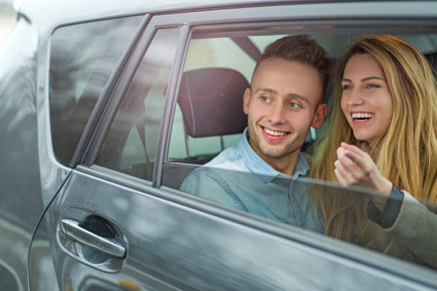 istock Young couple sitting in a car 919992068