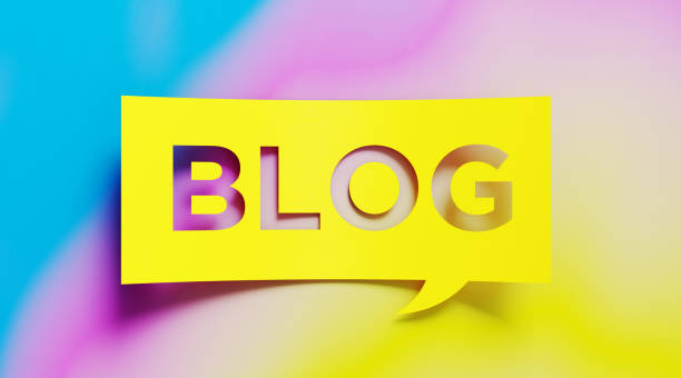 istock Blogging Concept - Yellow Blog Text  Over Colorful Background 919992336