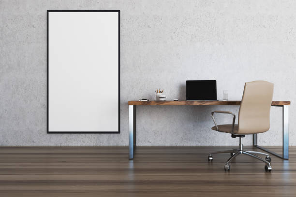 istock Concrete wall home office, table and poster 919998442