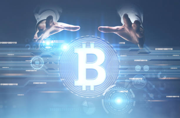 istock Man s hands above a bitcoin hologram 920000578