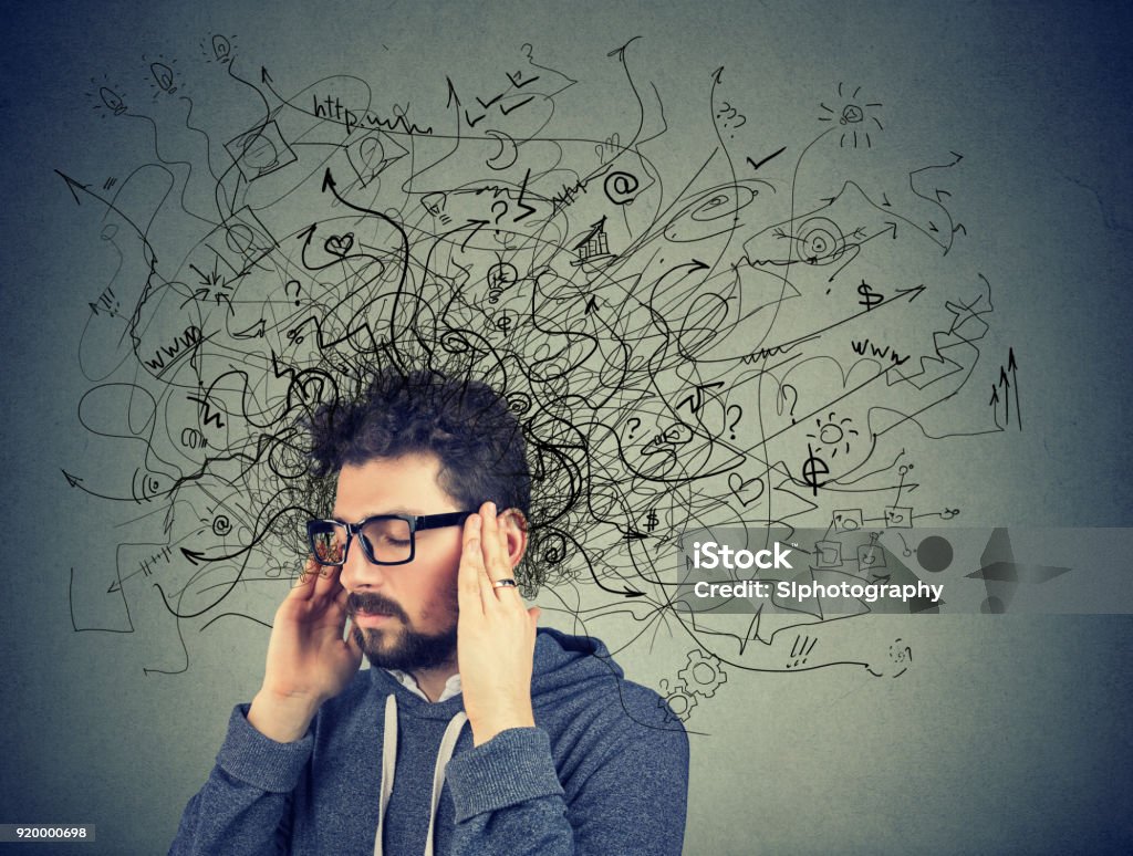Thoughtful stressed man with a mess in his head Thoughtful stressed young man with a mess in his head Adult Stock Photo