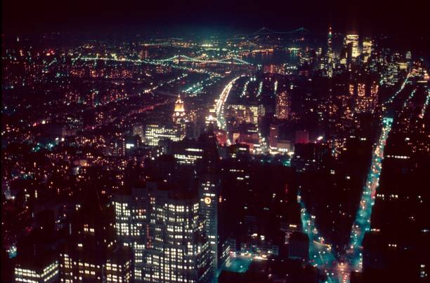 New York City at night, 1968 New York City, NYS, USA, 1968. Manhattan seen at night from the Empire State Bilding. new york city built structure building exterior aerial view stock pictures, royalty-free photos & images