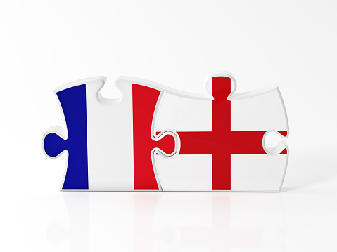 Jigsaw puzzle pieces textured with French and English flags on white. Horizontal composition with copy space. Clipping path is included.