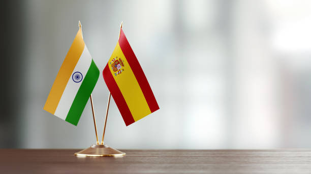 istock Indian And Spanish Flag Pair On A Desk Over Defocused Background 920008538