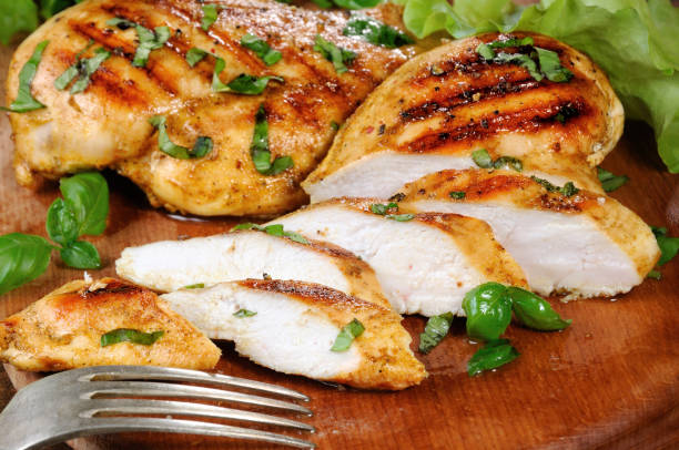 istock Sliced juicy, tender chicken breast grill close-up. 920011594