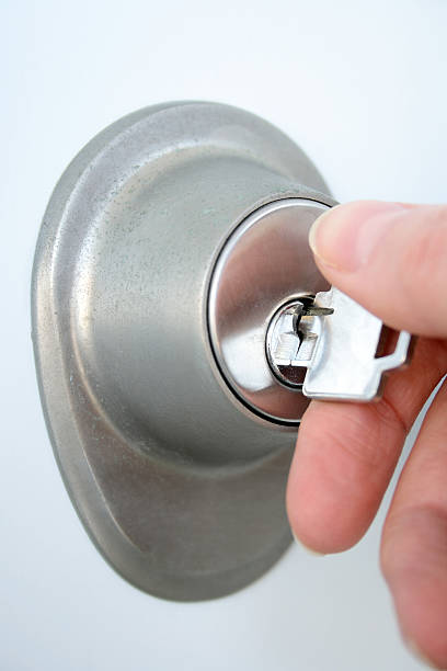 istock Hand unlocking the door with a key 92001794