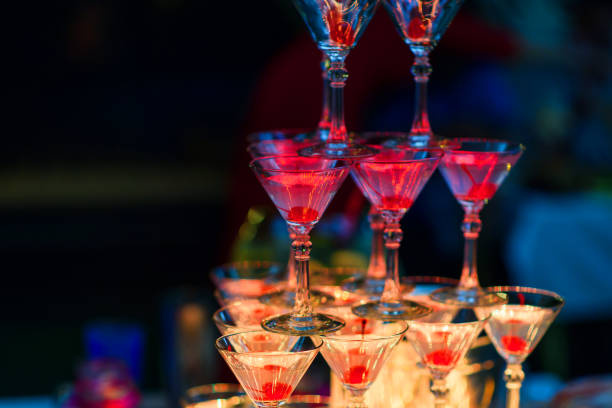 istock Martini glasses with cherries with red bright illumination 920027242