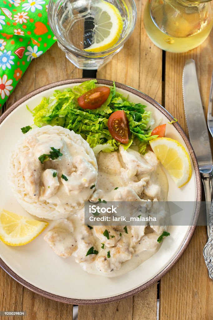 Chicken in cheesy creamy sauce served with rice Pieces of Beef Stroganoff Stock Photo