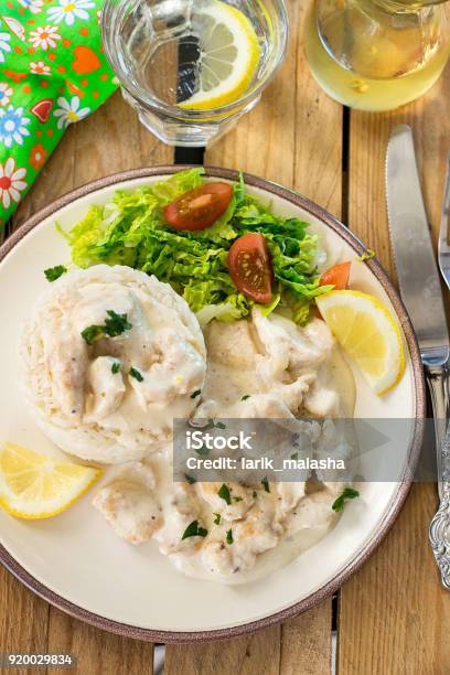 Chicken In Cheesy Creamy Sauce Served With Rice Stock Photo - Download Image Now - Beef Stroganoff, Biting, Cheese