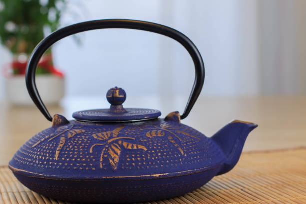 istock Blue Chinese cast iron teapot. Tea drinking. 920030340
