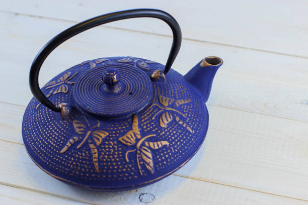 istock Blue Chinese cast iron teapot. Cooking utensils. 920030382