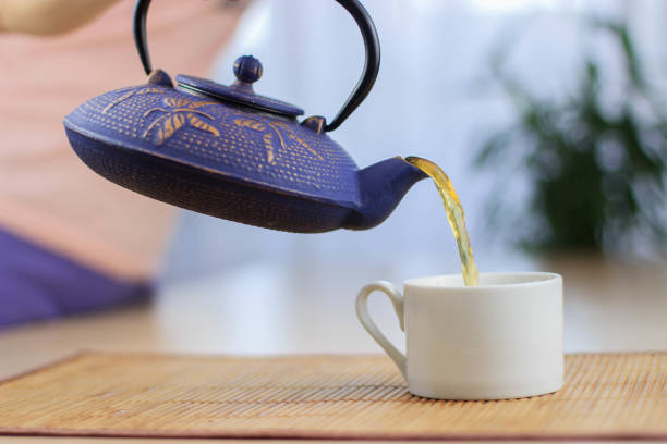 istock Blue Chinese cast iron teapot. The process of brewing tea. 920030432