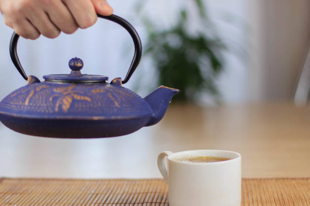 istock Blue Chinese cast iron teapot. The process of brewing tea. 920030446