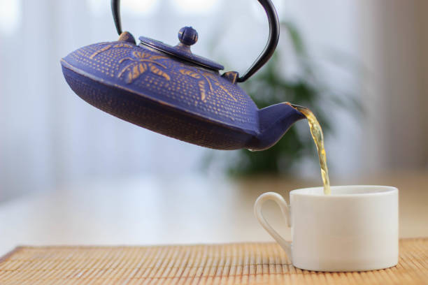 istock Blue Chinese cast iron teapot. The process of brewing tea. 920030452