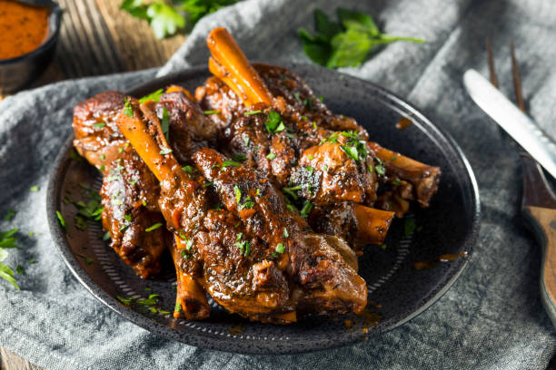 homemade braised lamb shanks - lamb shank dinner meal imagens e fotografias de stock