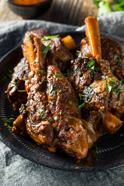 homemade braised lamb shanks - lamb shank dinner meal imagens e fotografias de stock