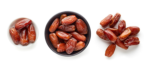 Pitted dates isolated on white background, top view