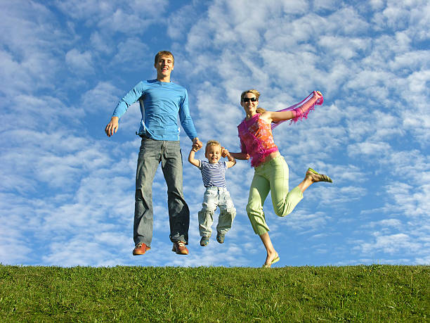 istock fly happy family on blue sky 92003130