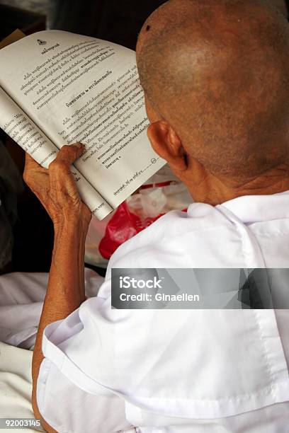 Reading Religious Words Stock Photo - Download Image Now - Active Seniors, Arranging, Asia