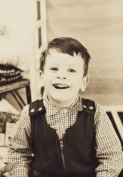 vintage cute toddler laughing at camera - 20th century style flash imagens e fotografias de stock