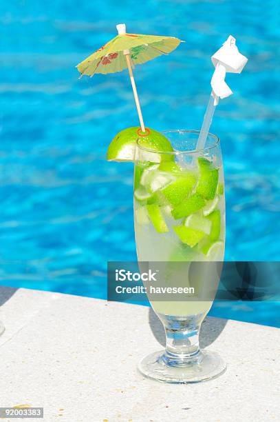 Foto de Caipirinha e mais fotos de stock de Ao Lado de Piscina - Ao Lado de Piscina, Azul, Bebida