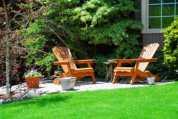 istock A patio with two wooden chairs outside a house 92003394
