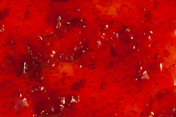 Close-up of strawberry marmalade Strawberry marmalade top view. Red Background jam stock pictures, royalty-free photos & images