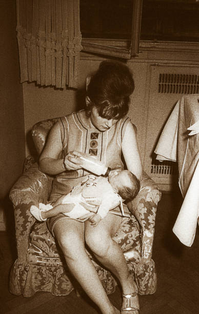 istock Mother from the sixties feeding her baby 920037772