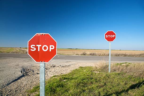 istock pair of stop traffic signs 92003784