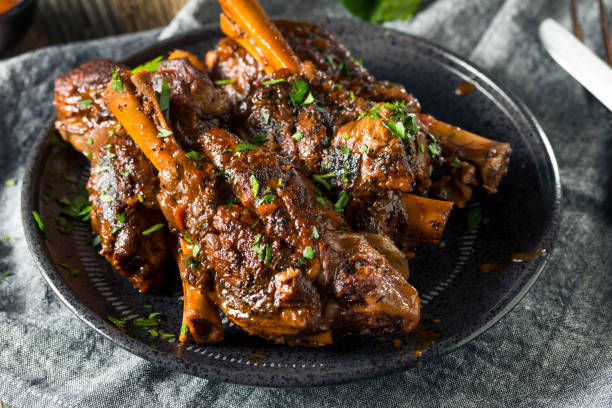 homemade braised lamb shanks - lamb shank dinner meal imagens e fotografias de stock